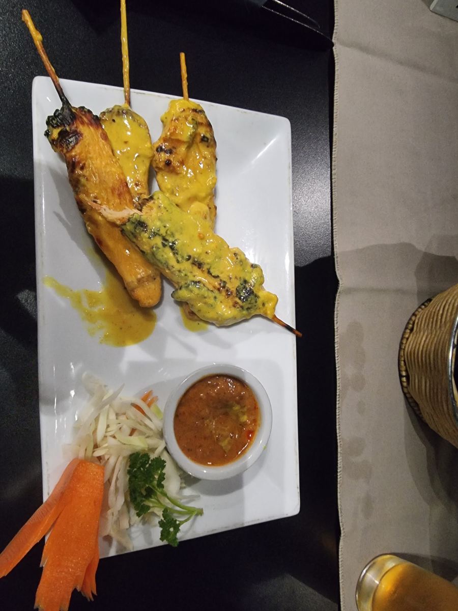 Grilled skewers with dipping sauce at Kamthai
